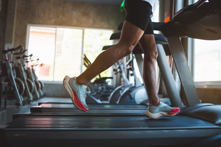 Close-up of a man's feet on a treadmill