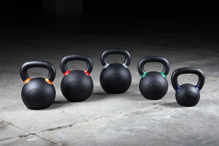 A row of five kettlebells