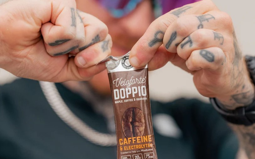 Close-up of a man opening an energy gel