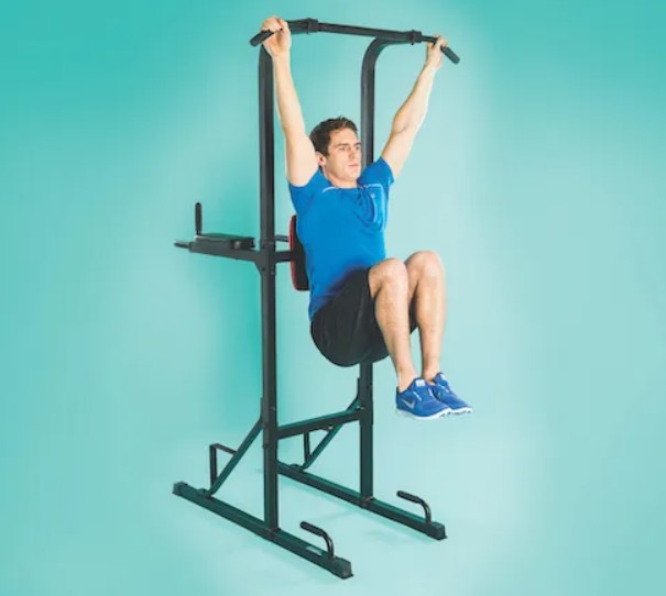 Man performing a hanging knee raise on a pull-up bar