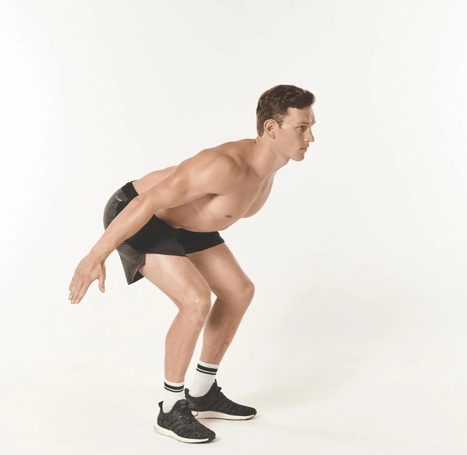 Man performing a jump squat