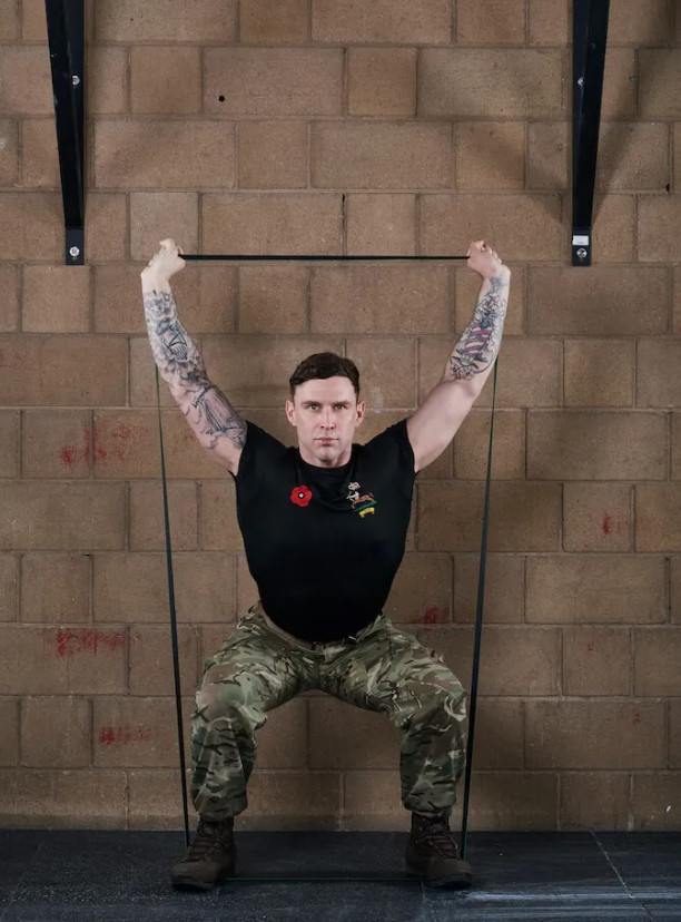 Man performing a banded overhead squat