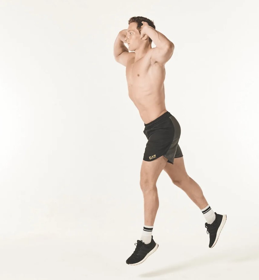 Man performing a plyometric split squat