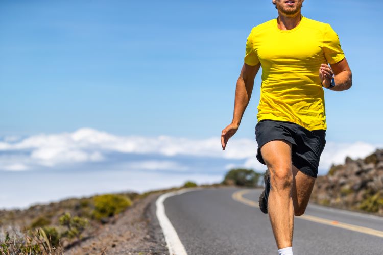 Close-up of a man in running shorts