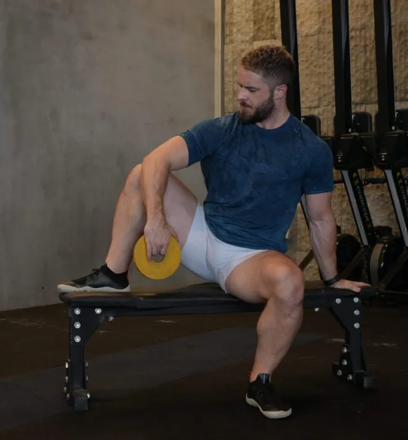 Man performing a seated external rotation