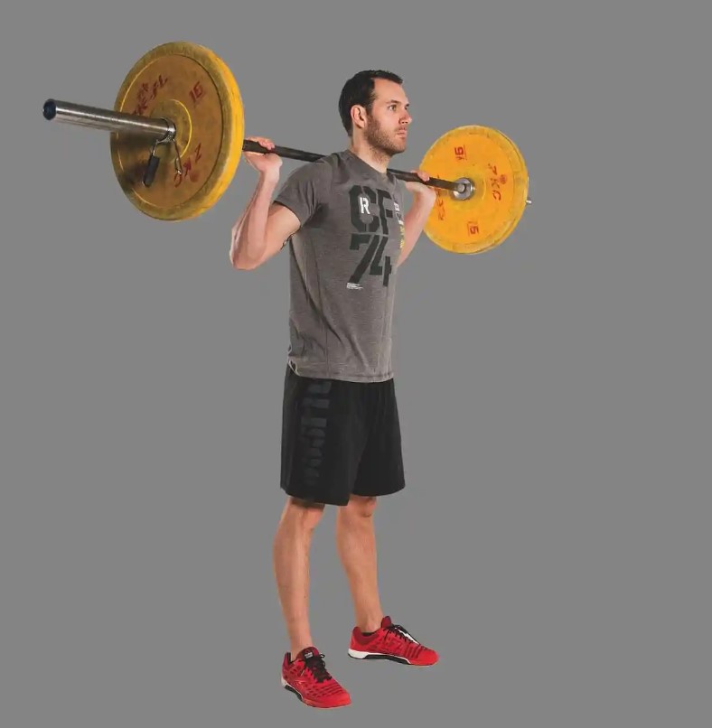 Man performing a barbell squat