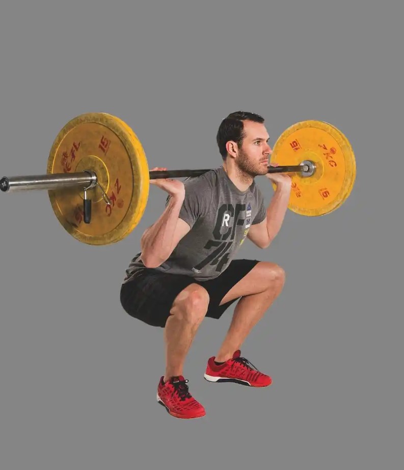 Man performing a barbell squat