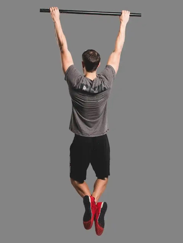 Man performing a wide-grip pull-up