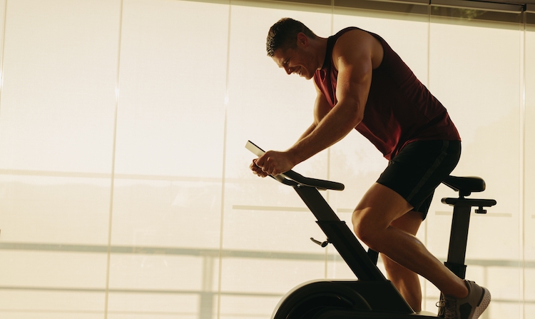 Man pedalling on an indoor exercise bike