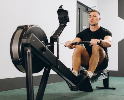 Man exercising on a rowing machine