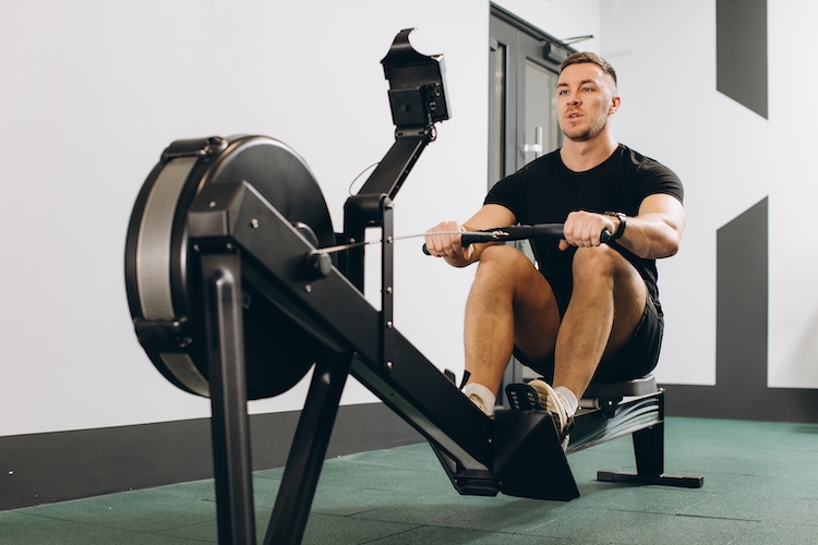 Man exercising on a rowing machine