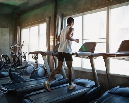 Man running on a treadmill in the gym