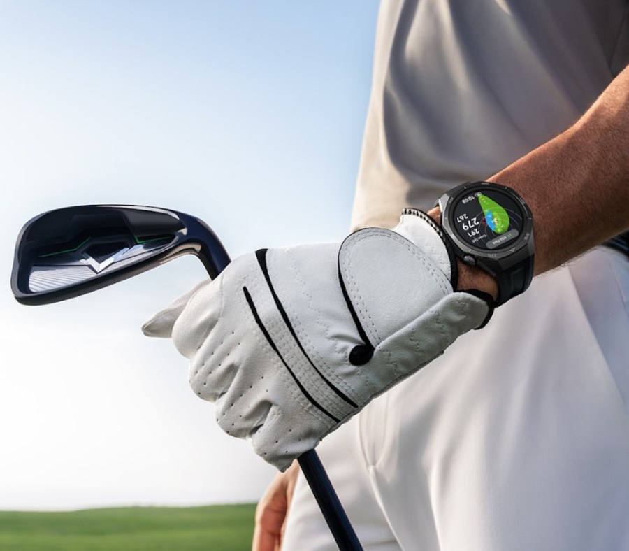 Close-up of a golfer's arm, holding a club