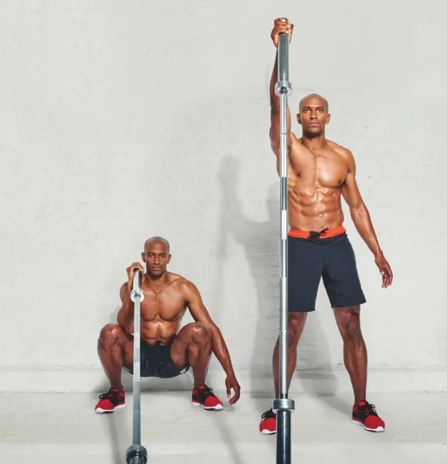 Man performing a landmine single-arm thruster exercise