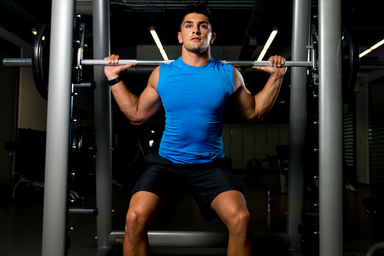 Man lifting a barbell in the gym