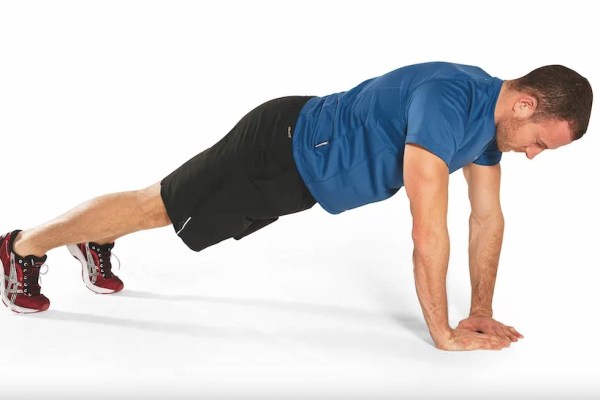 Man performing a diamond press-up