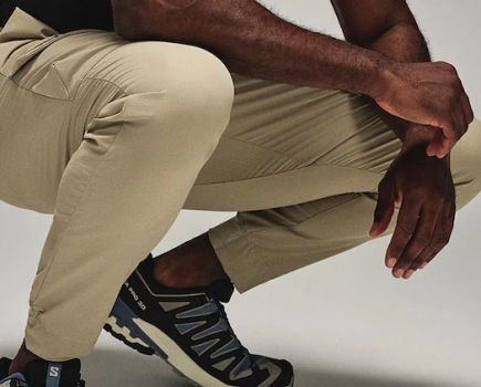 Close-up of a man crouching wearing joggers