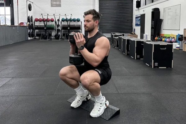 Man performing a dumbbell leg workout