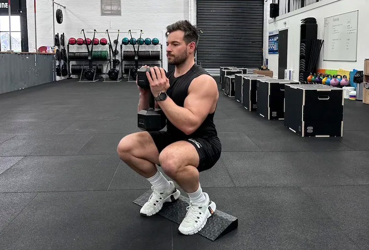 Man performing a dumbbell leg workout
