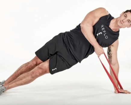 A man performing resistance band exercises