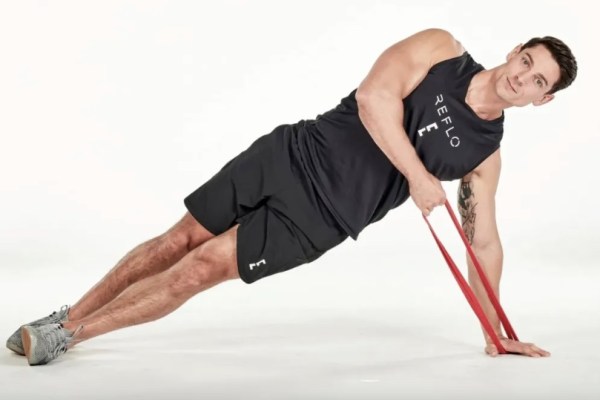 A man performing resistance band exercises