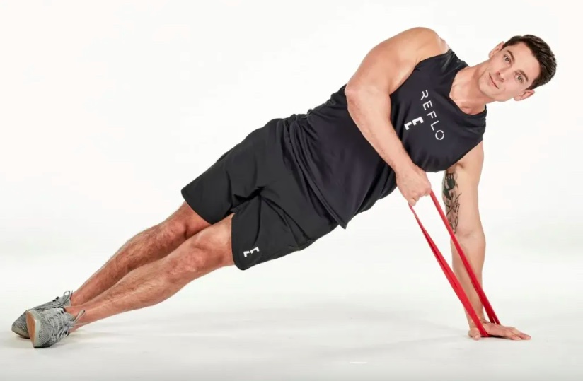 A man performing resistance band exercises