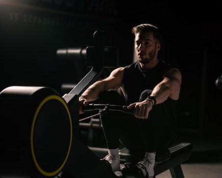 Close-up of a man exercising on a rowing machine