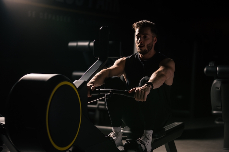 Close-up of a man exercising on a rowing machine