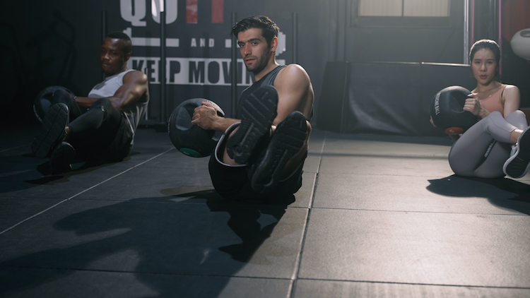 A group of men and women in a fitness class