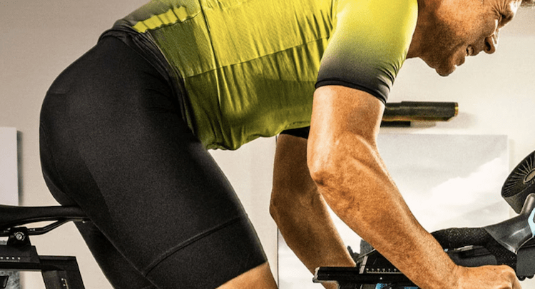 Close-up of a man riding an exercise bike