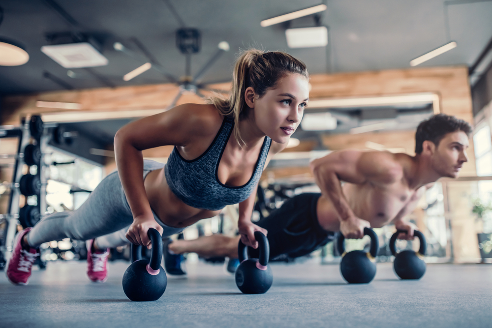 Couple exercising together in competition