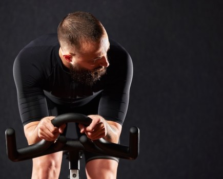 Close-up of a man on an indoor bike