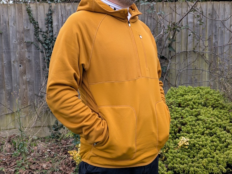 Close-up of a man wearing a brown hoodie