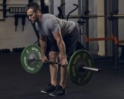 Man exercising in the gym with a barbell