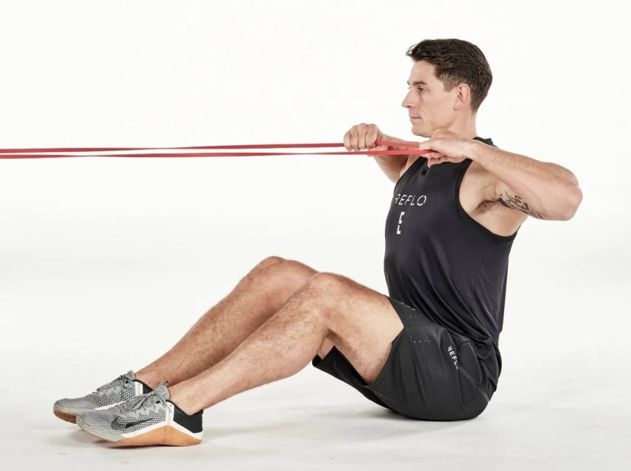 Man performing resistance band exercises