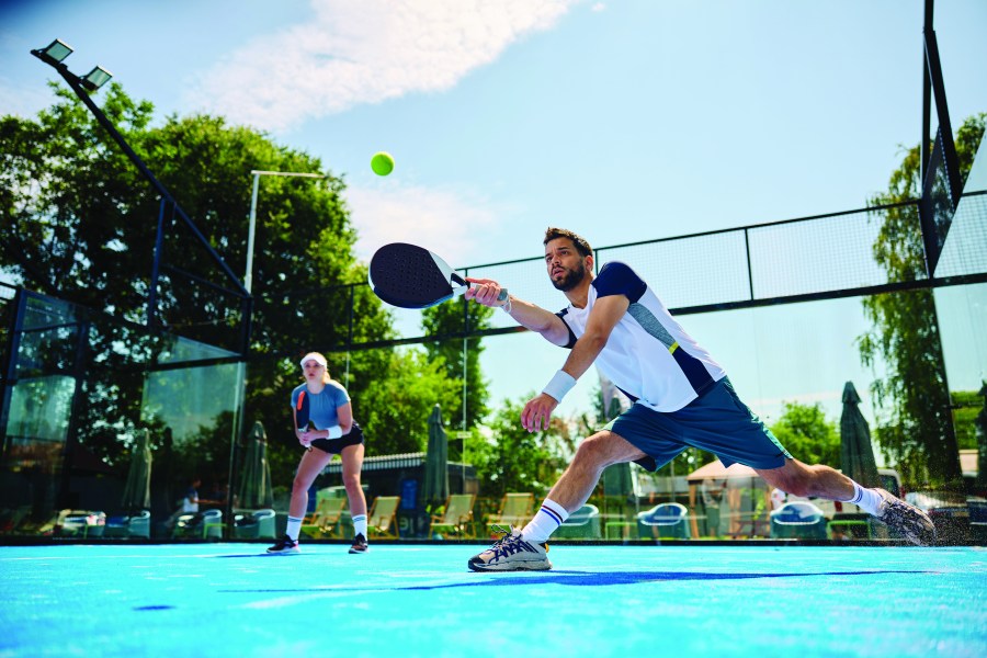 Two athletes playing padel