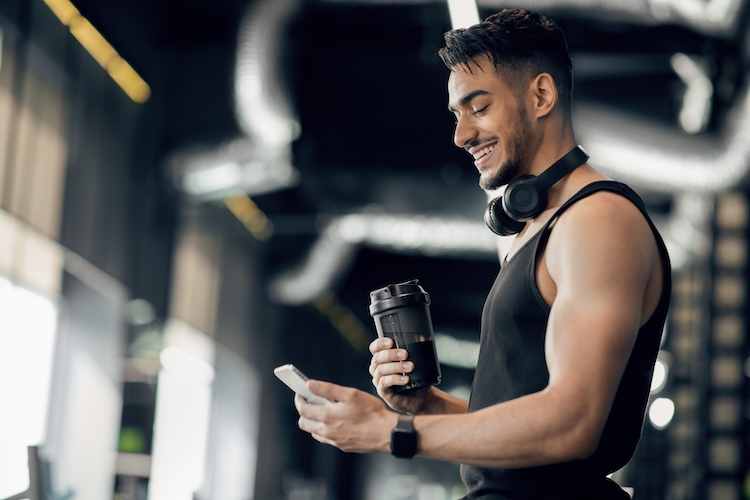 Man drinking a pre-workout drink