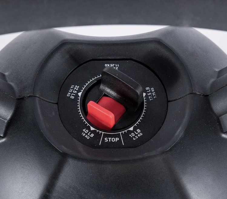 Close-up of the adjustment mechanism on an adjustable kettlebell