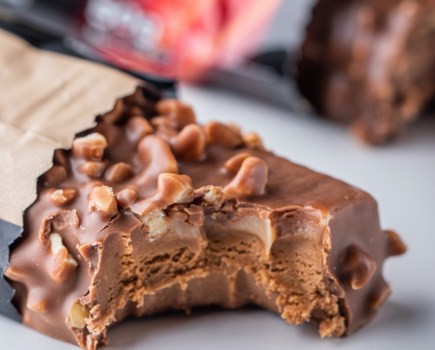 Close-up of a protein bar with a bite taken out