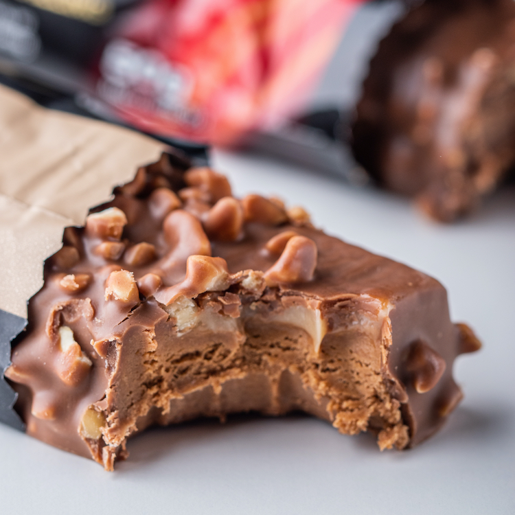 Close-up of a protein bar with a bite taken out