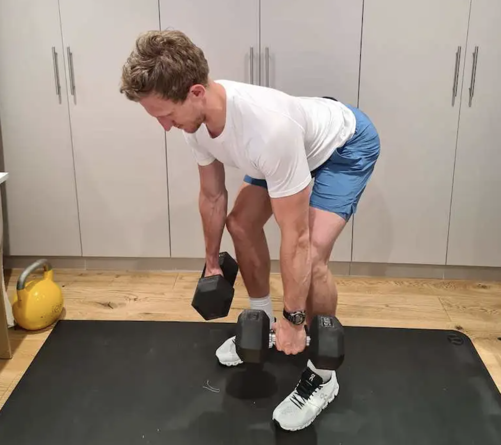 Man performing a dumbbell bent-over row