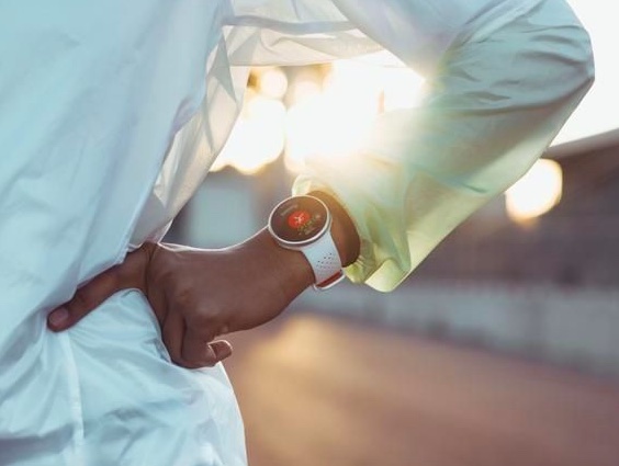 Product shot of a runner wearing a fitness watch