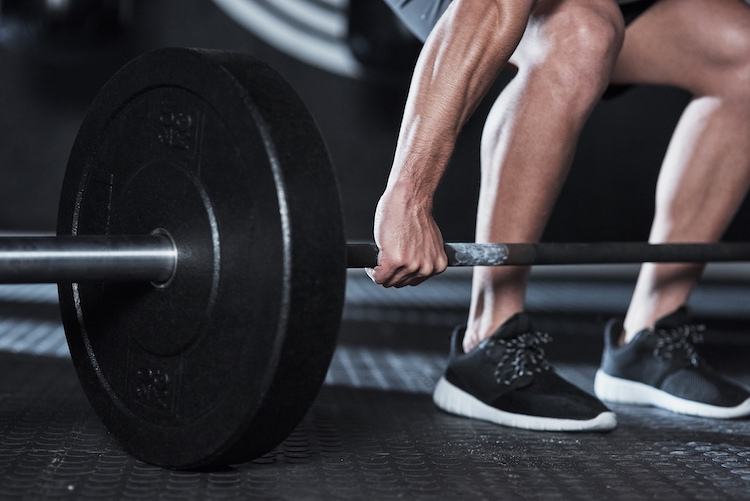 Close-up of man lifting dumbbell