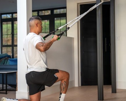 Man exercising with resistance bands