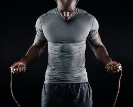 Upper torso of a man skipping