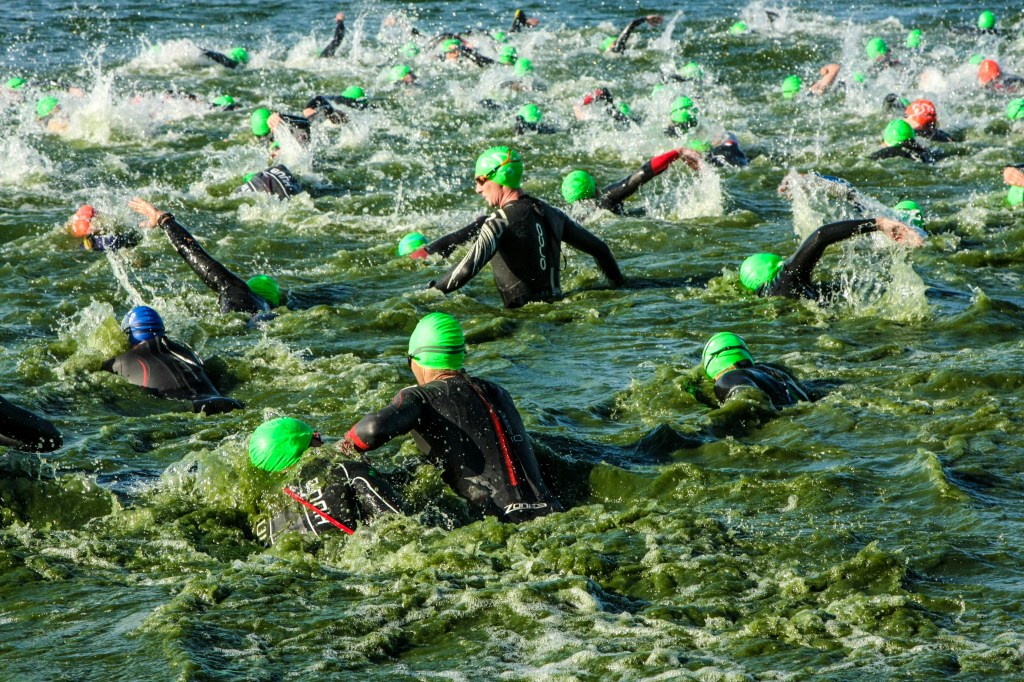 ironman triathlon swimmers in the water
