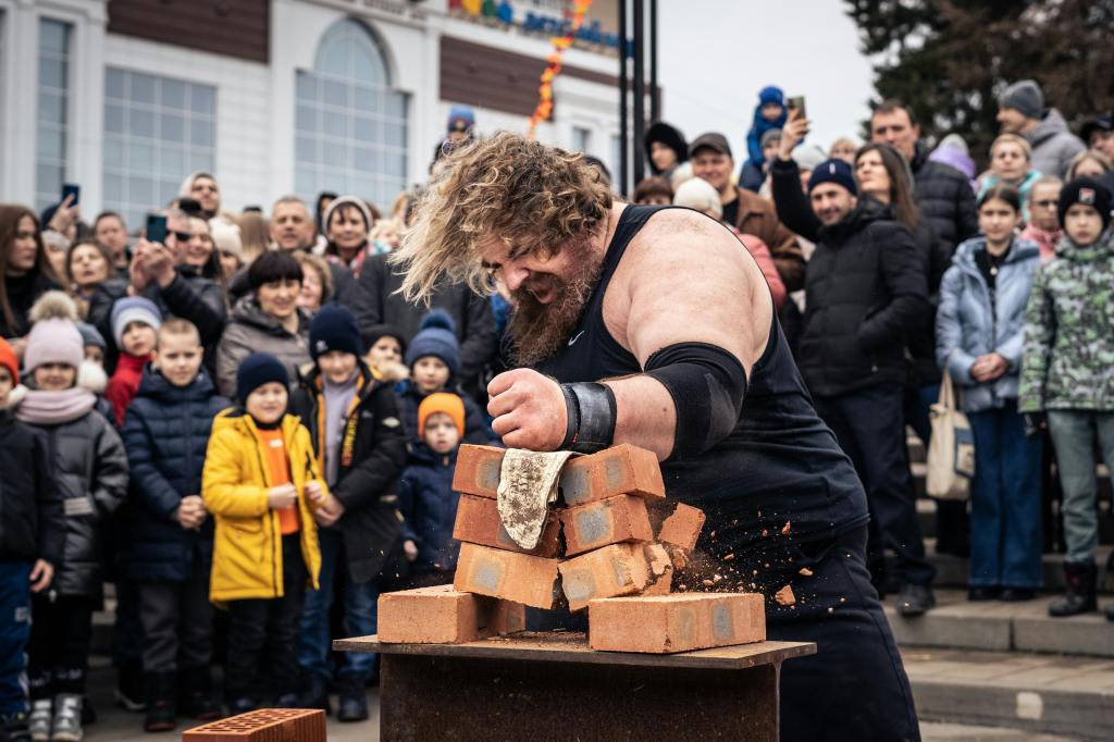 strongman competition man smashed through brick