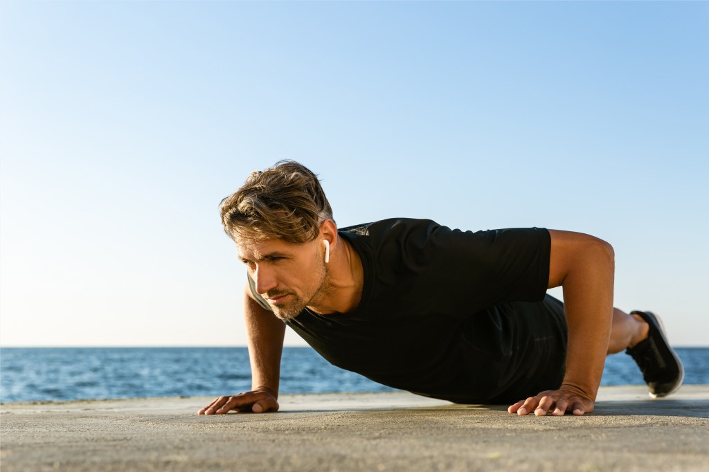 Middle-aged man doing a press up