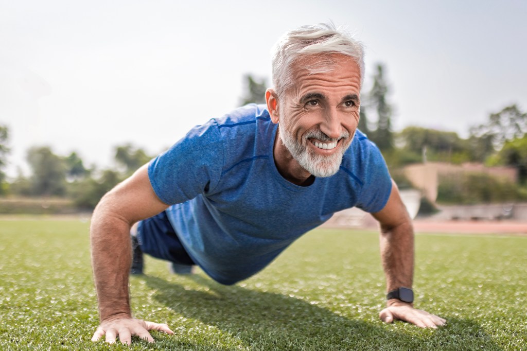 Senior man exercising, doing push ups