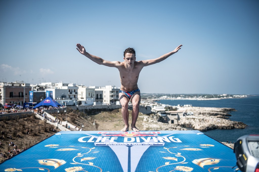 Aidan Heslop dives from the 27 metre platform during the first competition day of the seventh and final stop of the Red Bull Cliff Diving World Series 